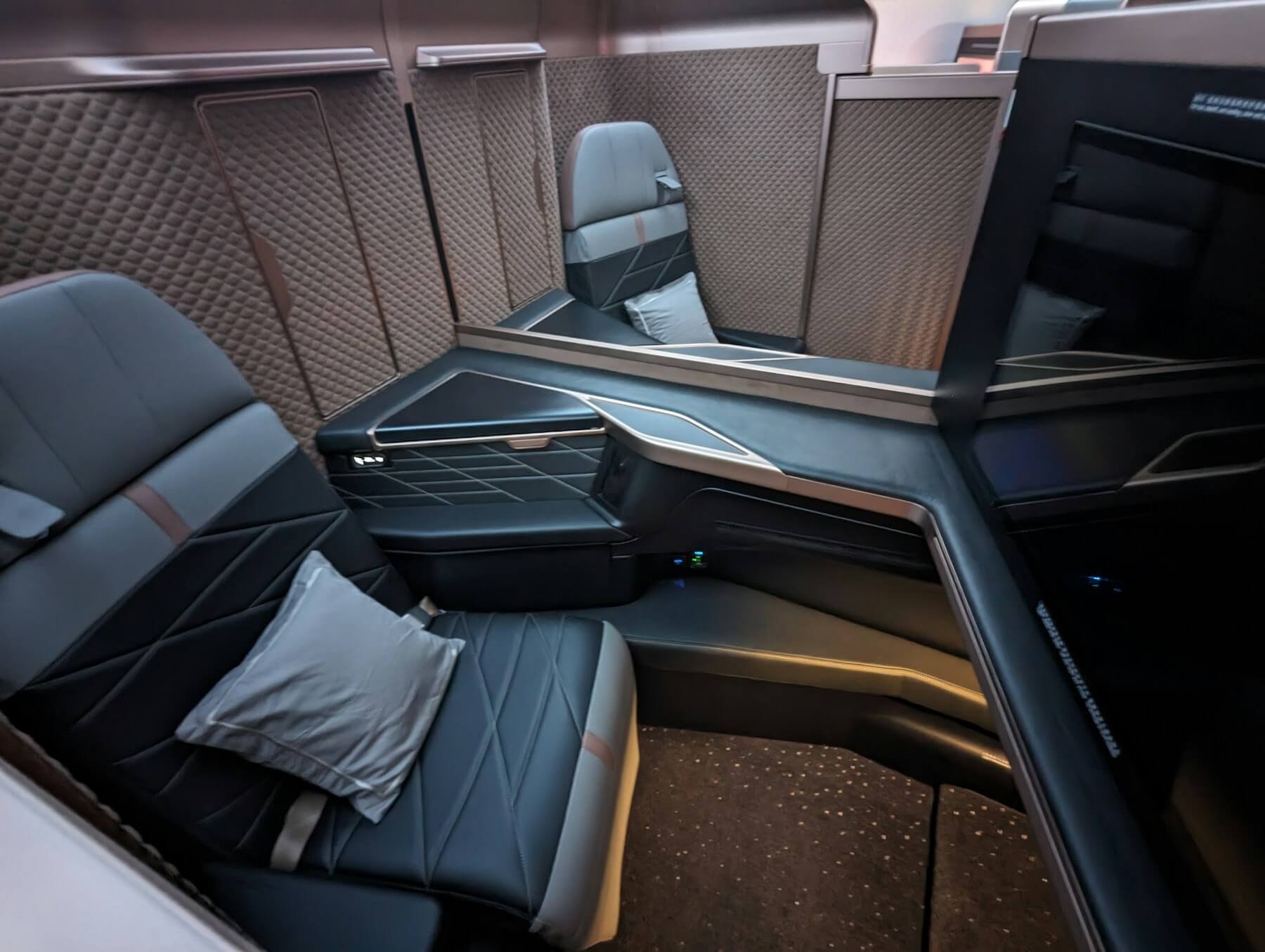 Qatar Airways Qsuite business class suite with sliding privacy door